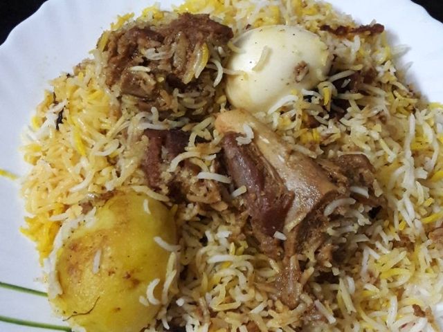 Unveiling the Culinary Elegance: Kolkata Gosht Dum Biryani at The Flavour Saga - The Flavour Saga