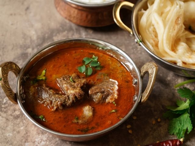 The Legacy of Mutton Rogan Josh: A Culinary Journey at The Flavour Saga - The Flavour Saga